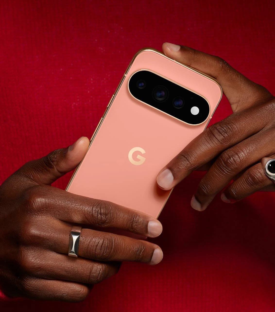 Google Pixel 11 Pro held in hand showcasing Canyon colour finish and polished edges